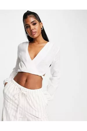 Pull&Bear Rustic long sleeve cut out wrap front cropped top in off