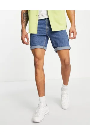 ASOS Stretch mid length denim shorts in flat mid wash blue