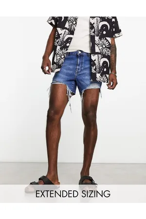 ASOS Shorter length denim shorts in midwash with rip detail and raw hem
