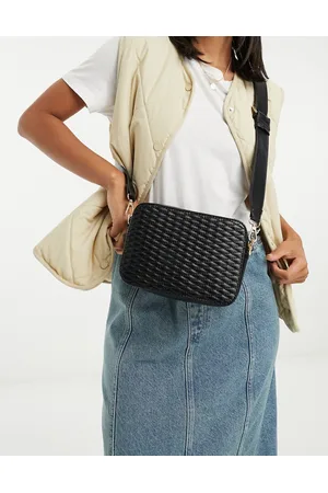 ASOS DESIGN leather curved base crossbody sling bag with contrast stitch in  black