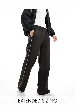 ASOS Baggy nylon track pants in with white piping