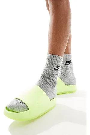 Nike Calm Mule slides in volt