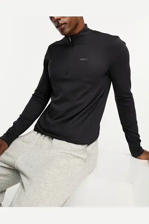 PUMA Training long sleeve quarter zip top in black