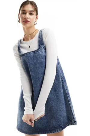 Monki Mini denim overalls dress in soft acid wash