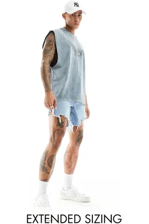 ASOS Mid length slim denim shorts with heavy ripped hem in light wash