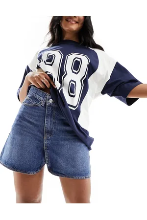 ASOS Denim mini skirt with cross front waist in mid wash