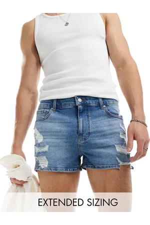 ASOS Super short length skinny denim shorts with rips in mid wash