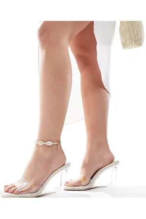 Public Desire Iggy wedge heeled lucite mules in