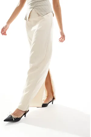 NA-KD X Laura Jade Stone maxi skirt with front pockets and back slit detail in beige