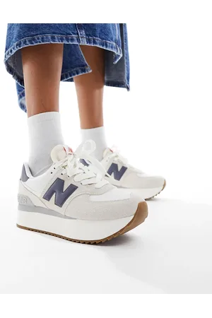 New Balance 574 sneakers in with navy detail