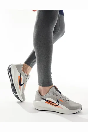Nike Downshifter 13 sneakers in and orange