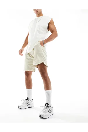 The Couture Club Varsity mesh shorts in beige