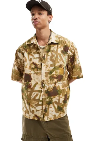 COLLUSION Boxy skater shirt with branding detail in graffiti print