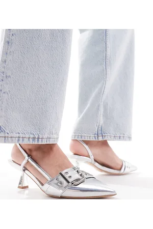 Simmi London Simmi London Wide Fit Dala pointed kitten heel sling backs with grommet buckle detail in metallic
