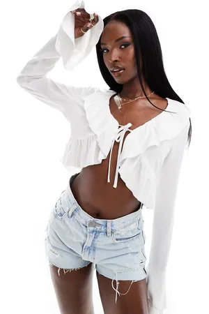 Aria Cove Linen-blend ruffle tie detail top in