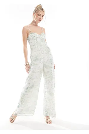 ASOS Raw edge corset paneled jumpsuit with cut out in blurred animal print