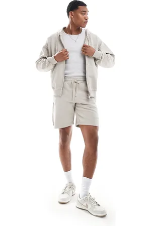 The Couture Club Raw seam jersey shorts in beige - part of a set