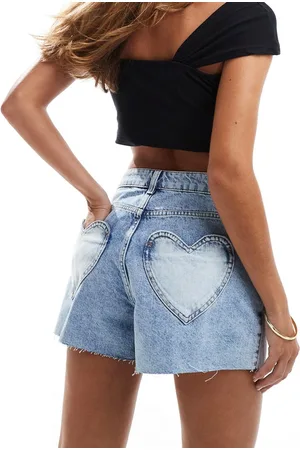 Miss Selfridge Heart pocket denim shorts in mid wash