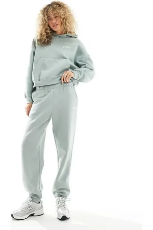 New Balance Linear Heritage brushed back track pants in light green