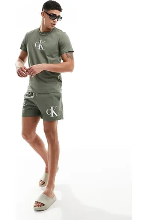 Calvin Klein Monogram medium drawstring swim shorts in olive