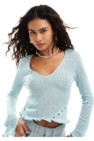 Monki Small rib v neck knit long sleeve top with hem detail in