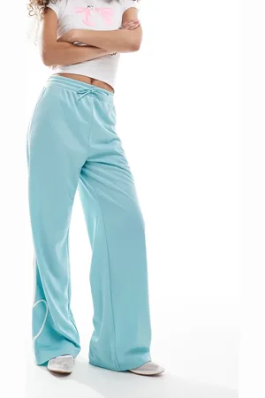 Monki Heart stripe straight leg track pants in light with white stripes