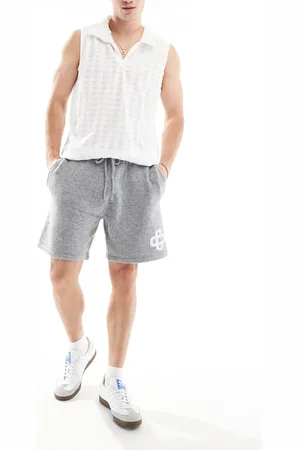 The Couture Club Emblem knit shorts in