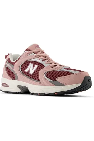 New Balance 530 sneakers in pink and burgundy