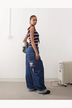 COLLUSION X008 Skater jeans in midwash with embroidery