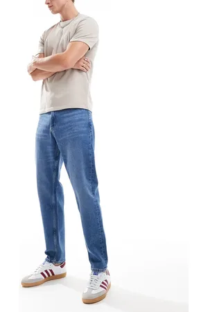 Tommy Hilfiger Isaac relaxed tapered jeans in mid wash