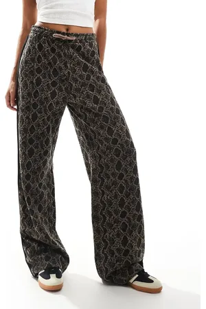 Monki Drawstring wide leg pants in snake print with black side stripe detail