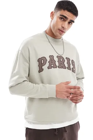 ASOS Oversized sweatshirt with chest applique in off