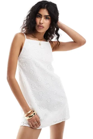 The Frolic Exclusive jewel eyelet high neck line strappy mini beach dress in
