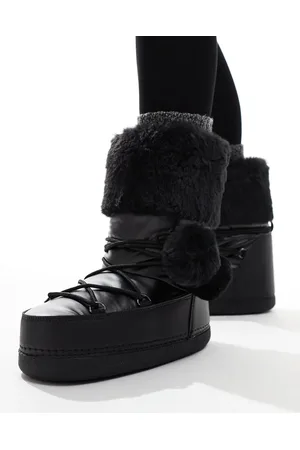 Public Desire Aster snowboots with fur trim and pom pom detail in