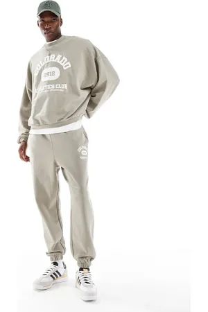 ASOS Oversized sweatpants with vintage varsity puff print in khaki