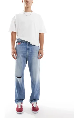 Tommy Hilfiger Skater ripped jeans in mid wash with flag details