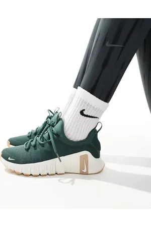 Nike Free Metcon 6 sneakers in dark and white