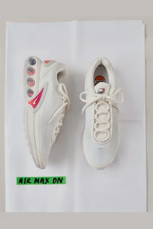 Nike Air Max DN sneakers in off and purple