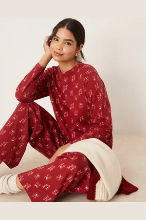 ASOS Printed christmas top and pants pajama set in bow print