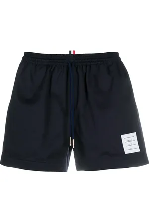 Thom Browne Shorts deportivos con cordones en la pretina
