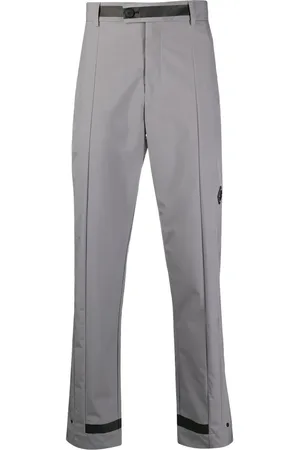 A-cold-wall* Pantalones rectos con placa del logo