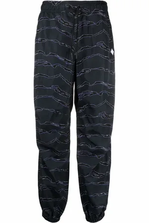 MARCELO BURLON Pants con estampado gráfico