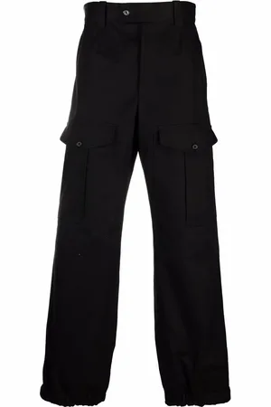 Alexander McQueen Pantalones con bolsillos y solapa