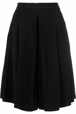 CHANEL Falda plisada con botón CC 1990