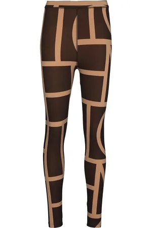 Totême Leggins con tiro alto y monograma