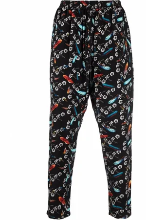 MARCELO BURLON Pants con estampado gráfico