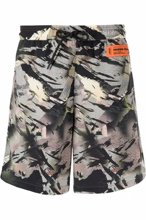 Heron Preston Shorts de playa con estampado abstracto