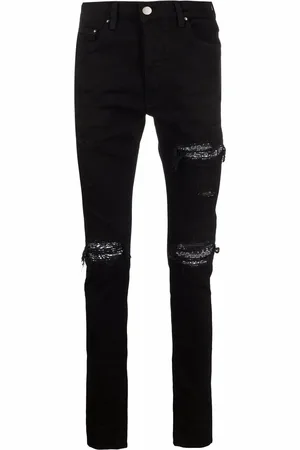 AMIRI Skinny jeans con detalles rasgados