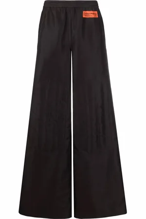 Heron Preston Pantalones anchos con parche del logo