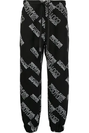 VERSACE Pants con logo estampado